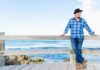 Best Multivitamin for Men Over 50 in 2020 man standing by ocean thinking about multivitamin for men over 50 years old