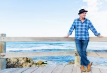 Best Multivitamin for Men Over 50 in 2020 man standing by ocean thinking about multivitamin for men over 50 years old