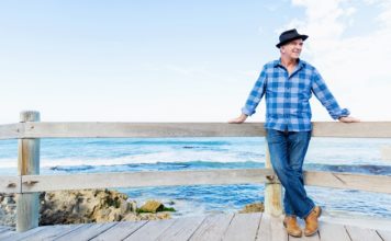 Best Multivitamin for Men Over 50 in 2020 man standing by ocean thinking about multivitamin for men over 50 years old