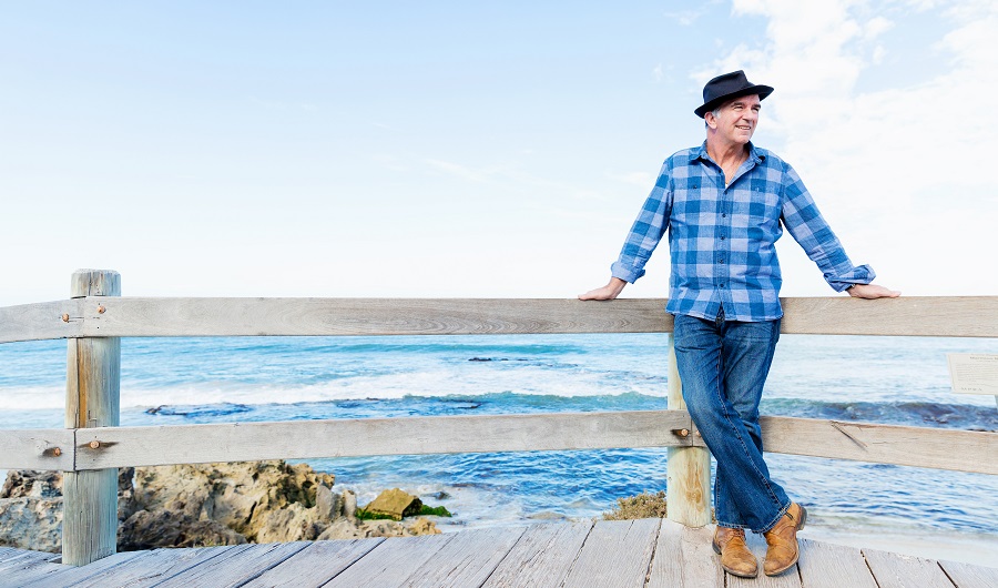 best multivitamin for men over 50 man standing by ocean thinking about multivitamin for men over 50 years old