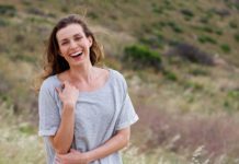 Best Multivitamin For Women Over 40 in 2020 woman laughing thinking about multivitamin for women over 40 years old