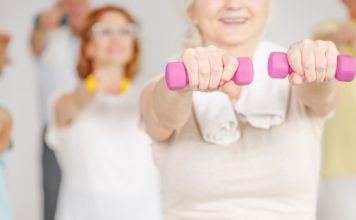 Best Multivitamin for Women Over 50 in 2020 exercise group of ladies with dumbbells after taking the multivitamins for women over 50 years old