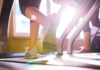 Best Running Shoes for Treadmill in 2020 Close up of legs of two women running on treadmills in a gym, sunny day with top rated shoes