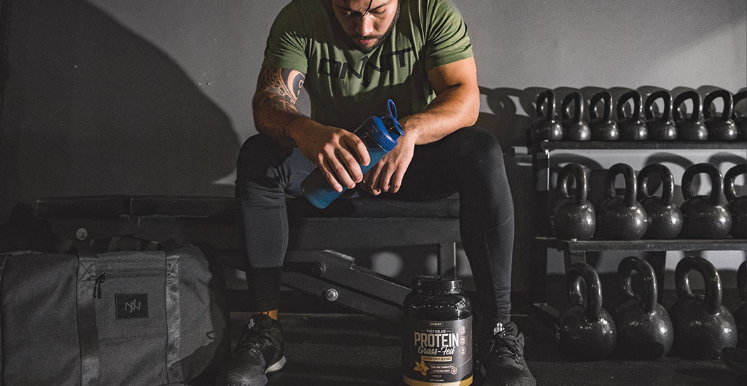 onnit grass fed whey protein review man post workout drinking an onnit grass-fed whey protein drink
